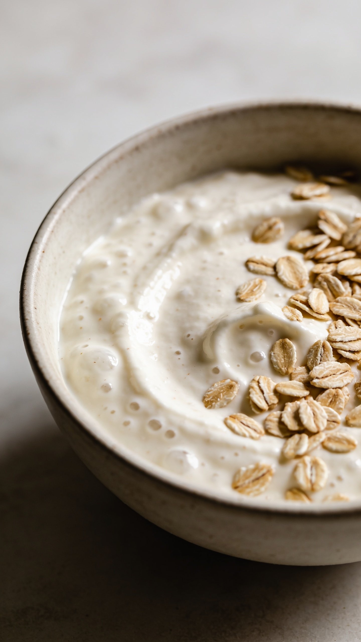 Closeup of a single bowl of batter showing Greek yogurt texture and oats