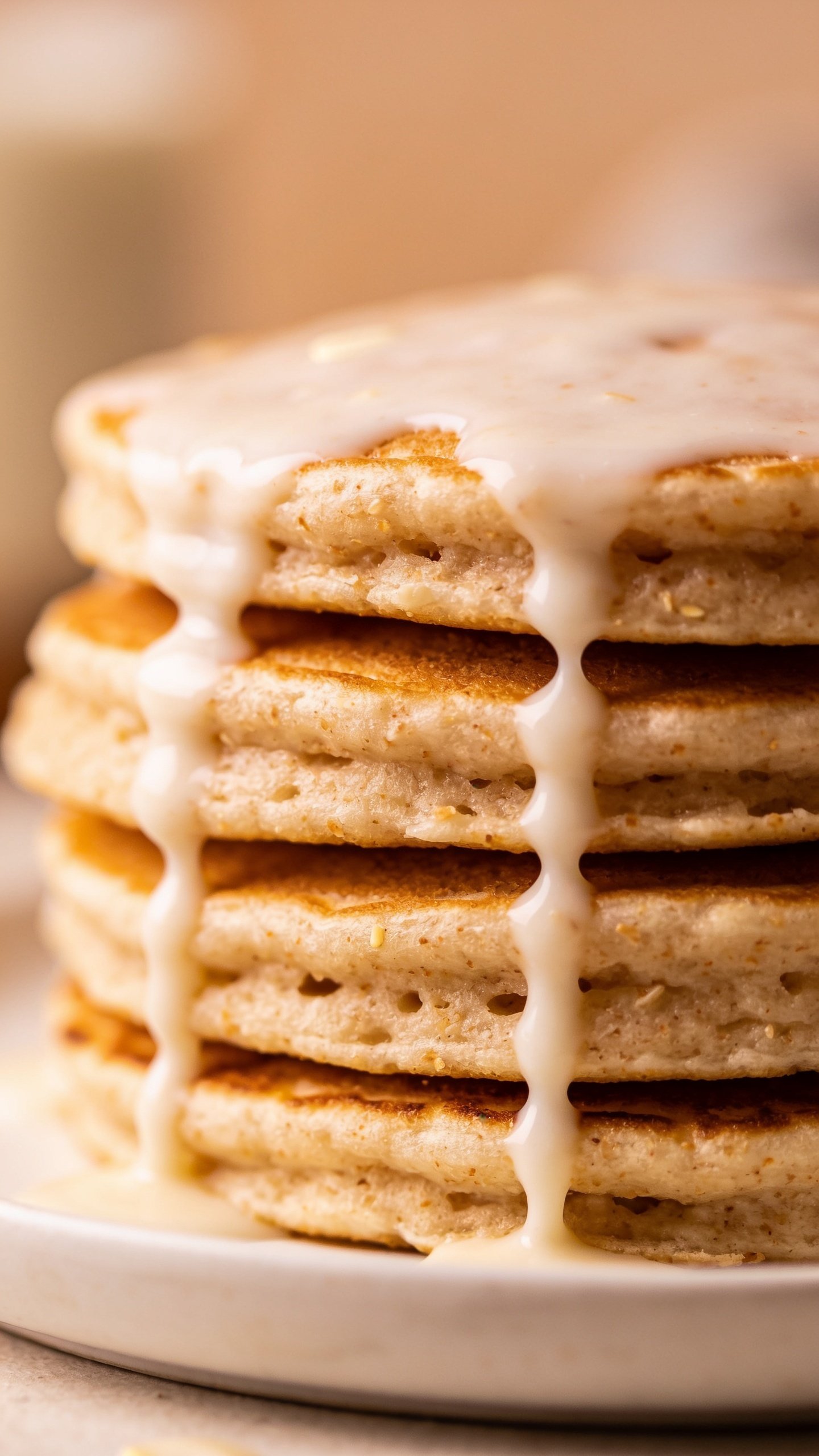 closeup of almond flour pancake stack with yogurt drizzle