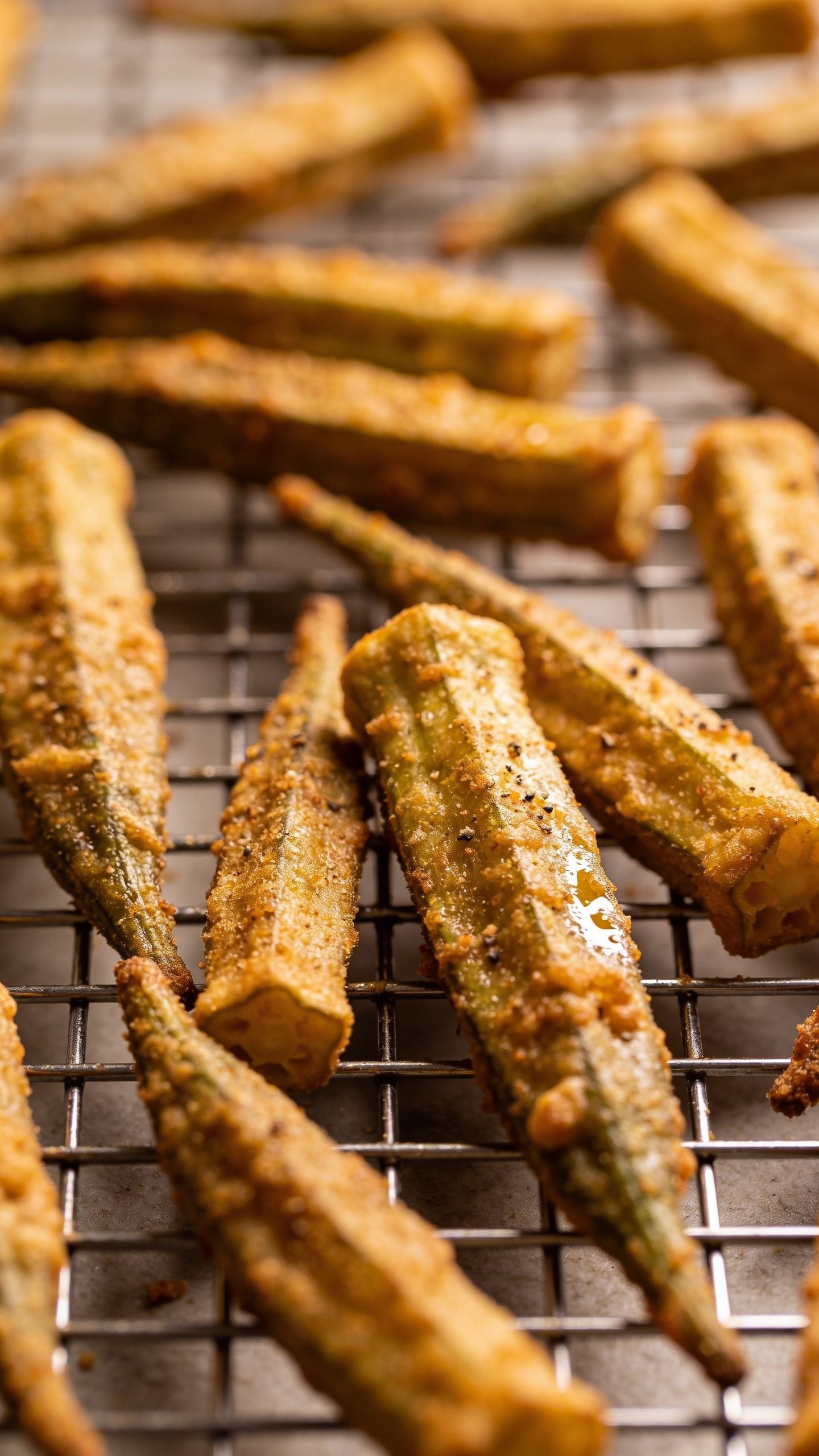 Closeup of crispy oven-fried okra on rack